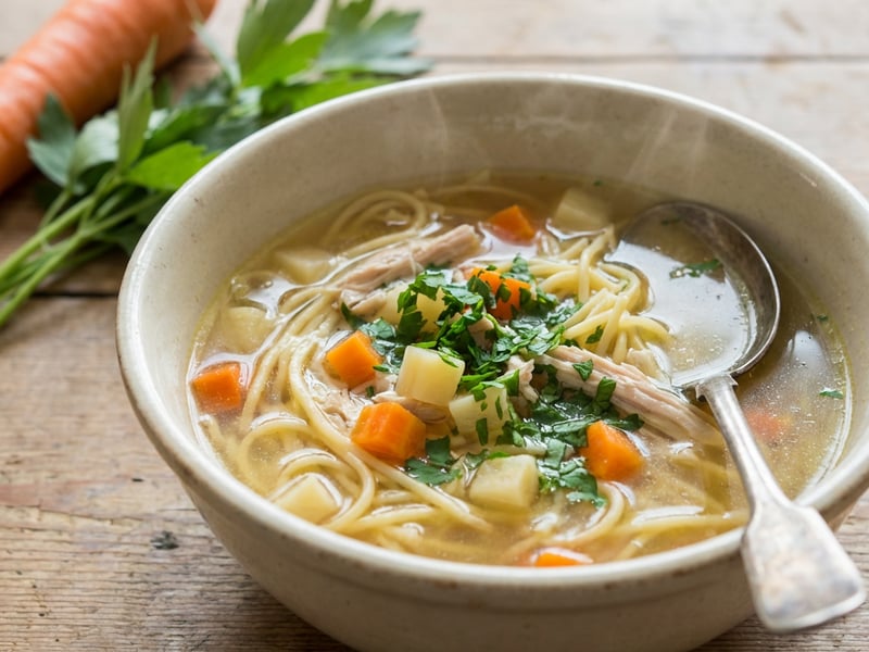 Chicken soup with noodles and roasted vegetables