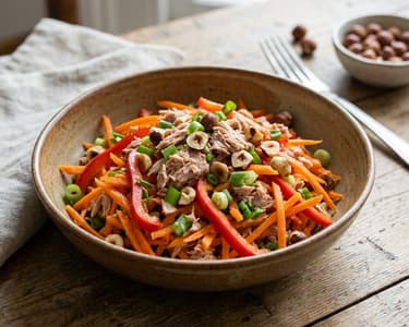 Carrot salad with tuna and hazelnuts