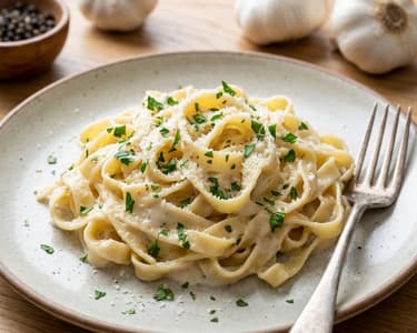 Pasta with creamy roasted garlic sauce