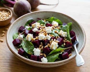 Red beet salad with goat cheese and pine nuts