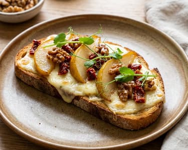 Raclette Cheese Toast with Sun-Dried Tomatoes and Grilled Pear